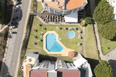 an overhead view of a building with a swimming pool at Dona Marieta House in Vilamoura