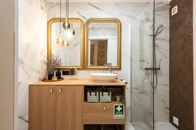 a bathroom with a sink and a shower at Dona Marieta House in Vilamoura