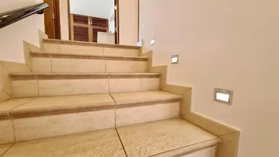 a staircase in a house with a mirror at Marina parque CD 68 - Cleverdetails - private pool, few steps to the marina in Vilamoura