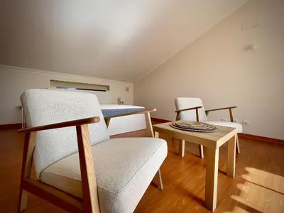 a room with two chairs and a table at Casa Falésia - 150 meters from Falésia Beach in Albufeira