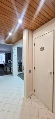 a room with a door and a dining room at Victory Village Club,Quinta do Lago in Loulé