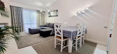 a living room with a table and a couch at Victory Village Club,Quinta do Lago in Loulé