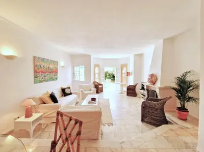 a large living room with a couch and chairs at Ancão beach duplex with private garden in Almancil