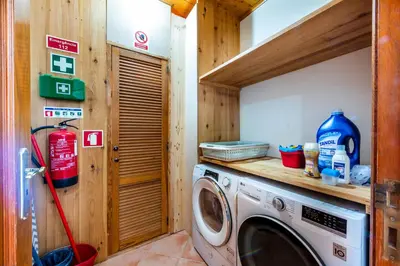 a washer and dryer in a wooden room at AL Monte Lusitano in Loulé