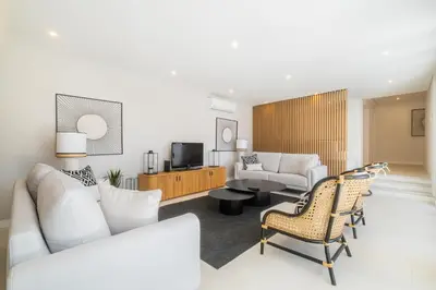a living room with a couch and a tv at Valbom Luxury Village in Galé
