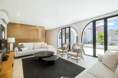 a living room with a white couch and chairs at Valbom Luxury Village in Galé