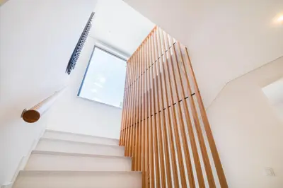 a staircase in a house with a window at Valbom Luxury Village in Galé