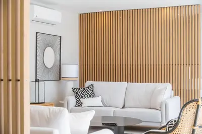 a living room with a white couch and a table at Valbom Luxury Village in Galé