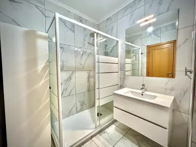 a bathroom with a sink and a mirror at Vilamoura Prestige 2 With Pool by Homing in Vilamoura