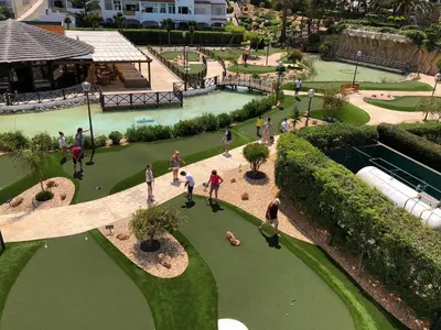 an overhead view of a park with people playing golf at Perfect ApartHotel Apartments 1 Bedroom in Albufeira