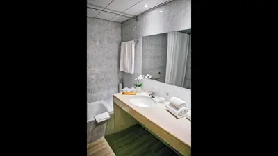 a bathroom with a sink and a tub at Perfect ApartHotel Apartments 1 Bedroom in Albufeira