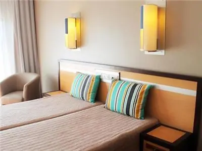 a hotel room with a bed with two pillows at Spectacular Albufeira 2 Bedroom apartment in the city center in Albufeira
