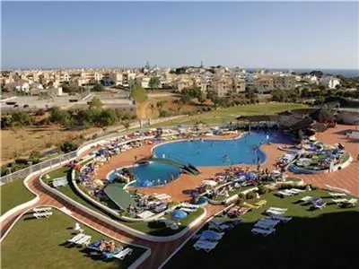 an aerial view of a swimming pool in a resort at Spectacular Albufeira 2 Bedroom apartment in the city center in Albufeira
