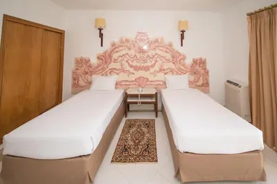 two beds in a hotel room with white sheets at Brilliant Apartments 1 Beedroom in Quarteira