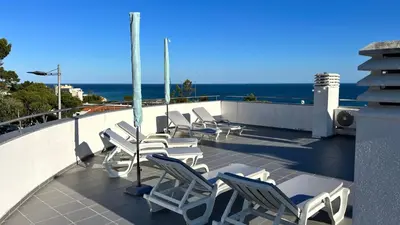 arial view of a villa with a view of the ocean at Beach Side Apartment in Albufeira