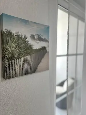 a picture of a fence and a beach at La vie simple appartement in Albufeira