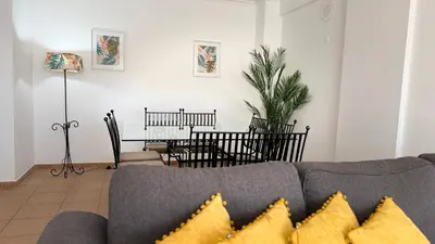 a hallway leading to a dining room with a table at Oura View Apartment in Albufeira