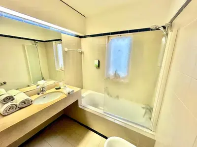 a bathroom with a sink and a shower at Heart of Quinta do Lago ! in Faro