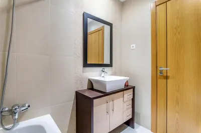 a bathroom with a sink and a mirror at Villa Feliz Algarve with Private Pool - São Rafael in Albufeira