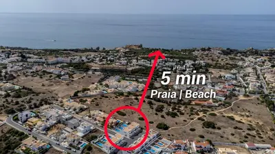 a map of a city with a red arrow at Villa Feliz Algarve with Private Pool - São Rafael in Albufeira