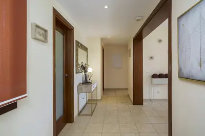 a hallway with a tile floor and a hallway with at BmyGuest - Vilamoura Vila Sol Golf II in Vilamoura