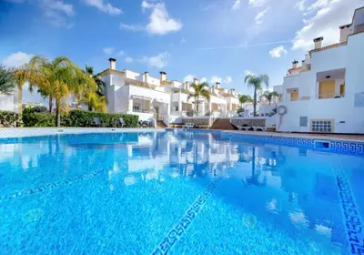 a large swimming pool in front of a villa at Farmvillage Apartment - Free Wifi in Albufeira