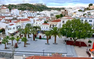 a city with palm trees and white buildings at Casa Merrigan in Albufeira