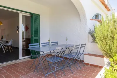 a table and chairs sitting on a patio at Centralgarve - Excellent & Peaceful Villa in the Center of Vilamoura in Vilamoura