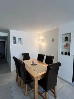 a dining room with a wooden table and black chairs at Rui's Studio - Farmvillage - Free Wifi in Albufeira