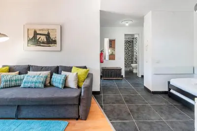 a bedroom with a bed and a bathroom at 1BR Apartment with Pool @ Lago Azul in Quarteira