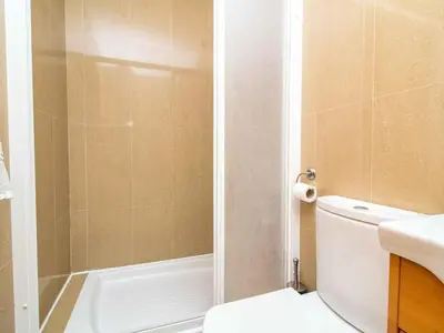 a bathroom with a shower and a toilet and a sink at White 47 House by Stay ici Algarve Holiday Rental in Albufeira