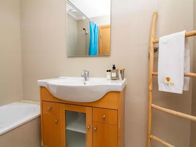 a bathroom with a sink and a mirror at White 47 House by Stay ici Algarve Holiday Rental in Albufeira