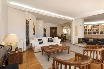 a living room with a couch and a table at Vila Caraibas - Vilamoura - by HDproperties in Vilamoura