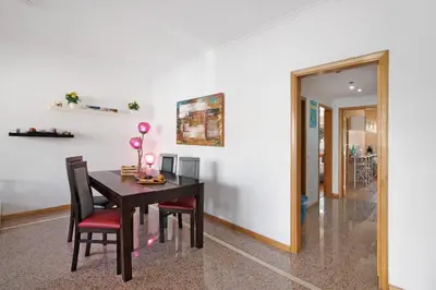a dining room with a table and chairs at Casa da Saudade no centro de Faro in Faro
