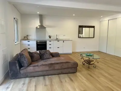 a living room with a couch and a table at Quinta Verde Algarve in Medronhal