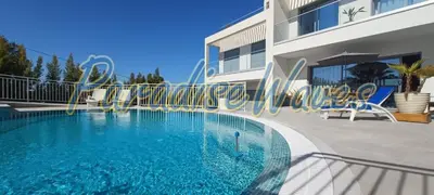 a swimming pool in front of a building at Maison avec piscine et jacuzzi in Guia