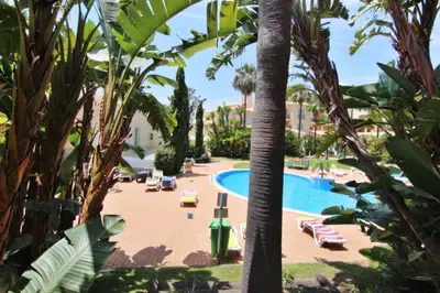 a view of the pool from the balcony of a resort at Los Arcos 3 - Pool & Vilamoura Center in Vilamoura