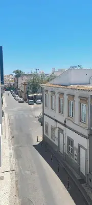 an empty street with a building on the side of it at Apartment Center View in Faro