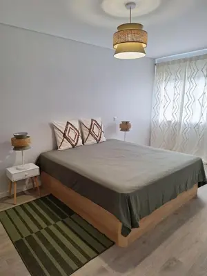 a bedroom with a large bed in a room at Apartment Center View in Faro