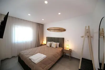 a bedroom with a bed and a window at Sea Turtle Apartment - Albufeira in Albufeira