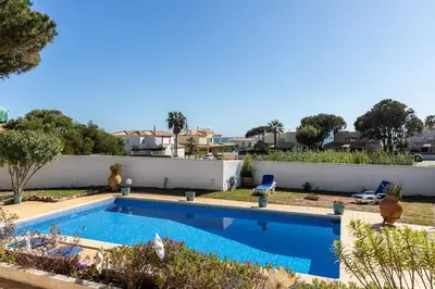 a swimming pool in the backyard of a house at NEW! 4bedroom Villa - Private Pool and Sea view in Guia