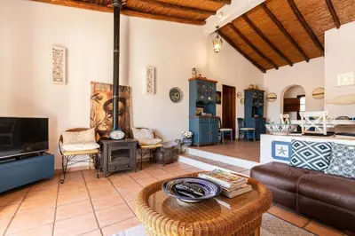 a living room with a couch and a table at NEW! 4bedroom Villa - Private Pool and Sea view in Guia