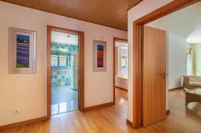 a living room with a door open to a living room at Marina de Albufeira by Garvetur in Albufeira