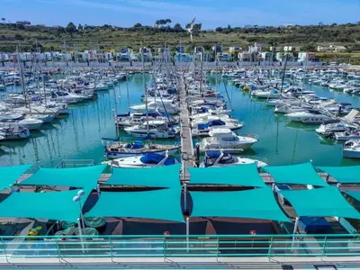 a bunch of boats docked in a harbor at Luxury 1 Bedroom Apartment, Marina de Albufeira in Albufeira
