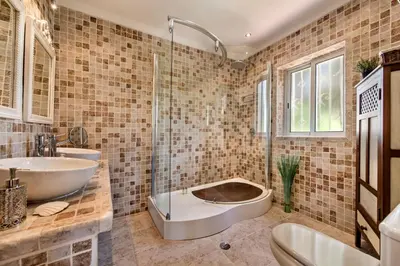 two beds in a room with a window at 4 Bedrooms Private Pool Close To All Amenities in Quarteira