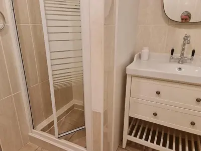 a bathroom with a shower and a sink at Casa dos Arcos in Olhos de Água