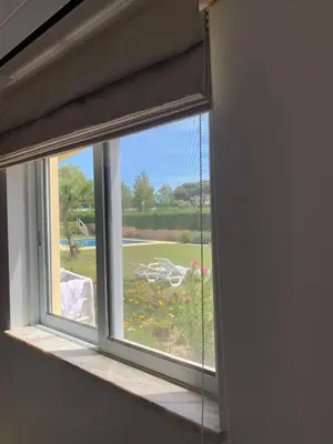 a window with a view of a yard at Galé Garden House in Guia