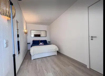 a small bedroom with a bed and a hallway at Sea View One Bedroom with Swimming Pool Ponce 282 in Albufeira