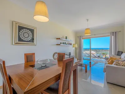 a patio with a table and chairs on a balcony at Apartment Vista Mar by Interhome in Albufeira