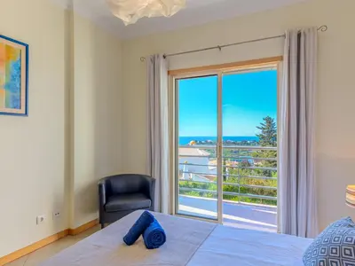 a kitchen and dining room with a table and chairs at Apartment Vista Mar by Interhome in Albufeira